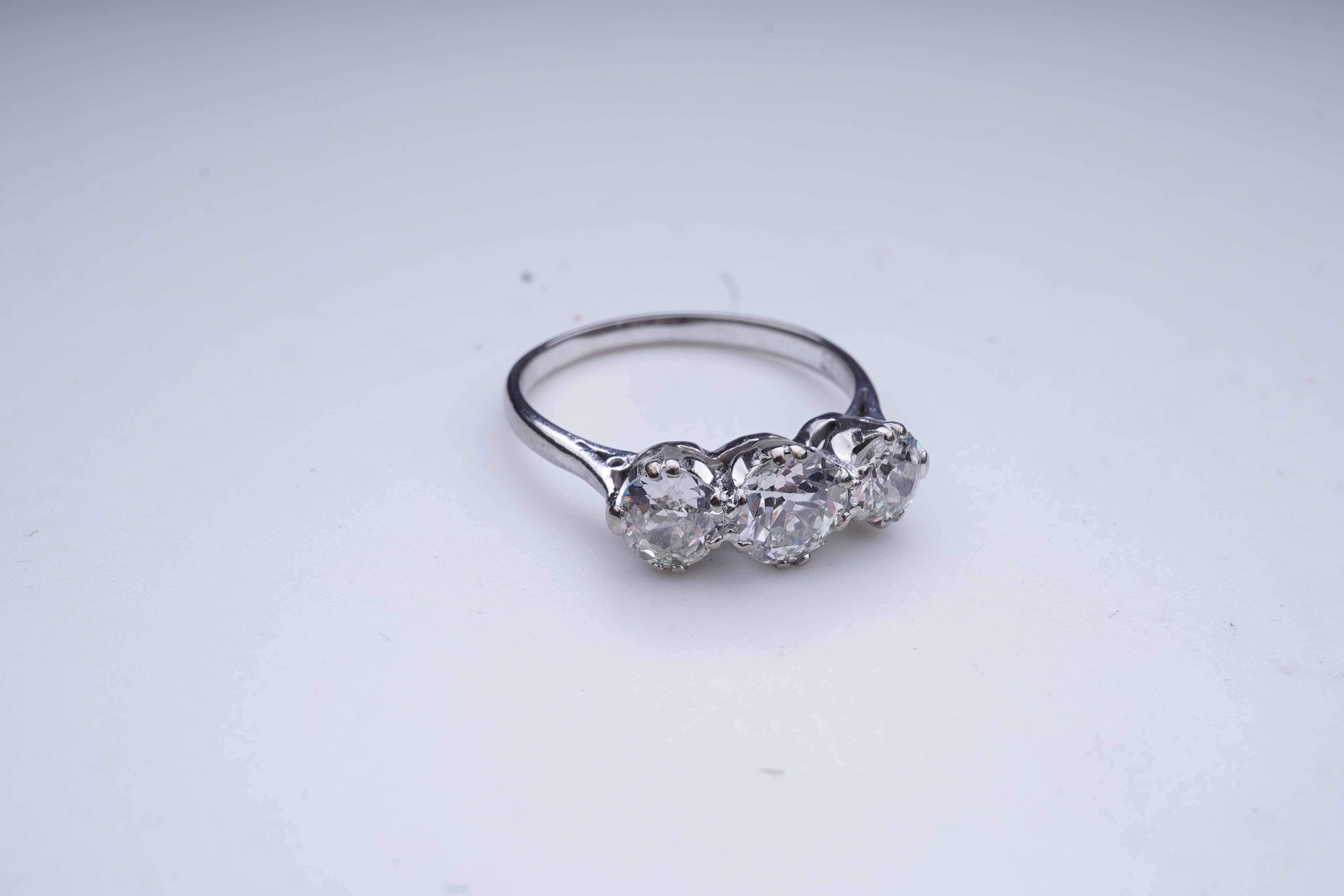 A three-stone diamond ring, early 20th century